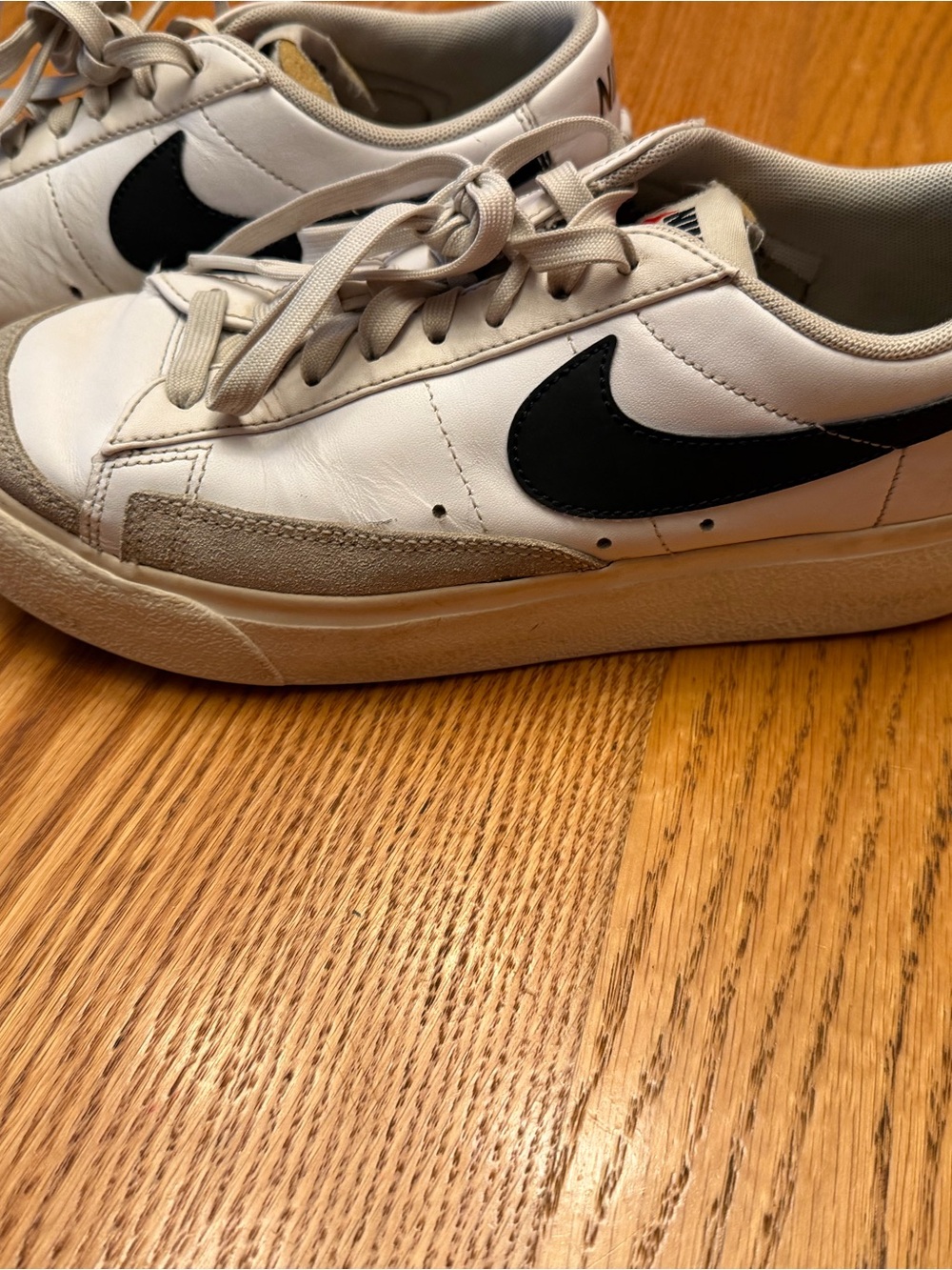 Nike White Sneakers with Red Swoosh Accent